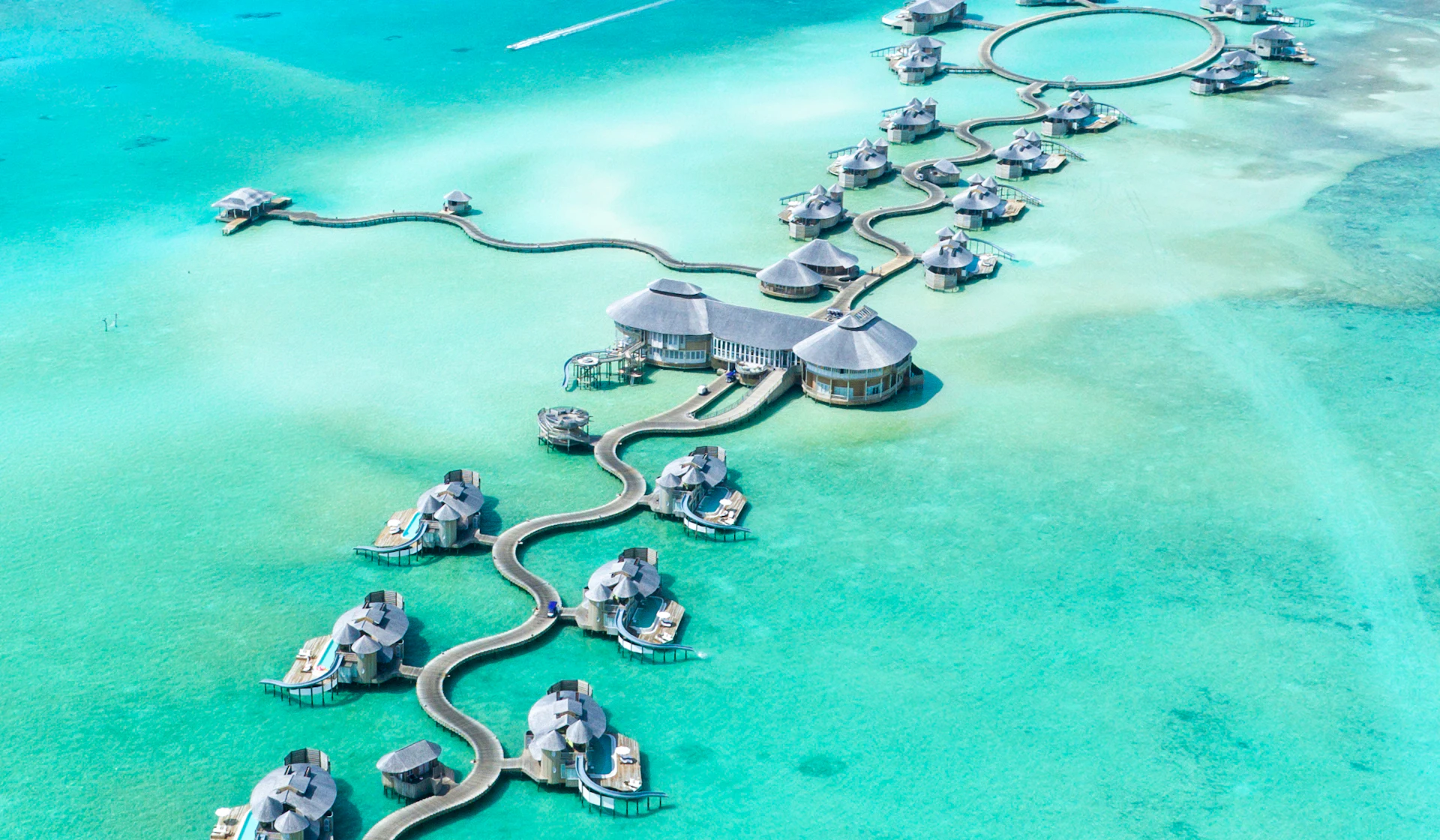 Overwater villas surrounded by the turquoise waters of the Maldives